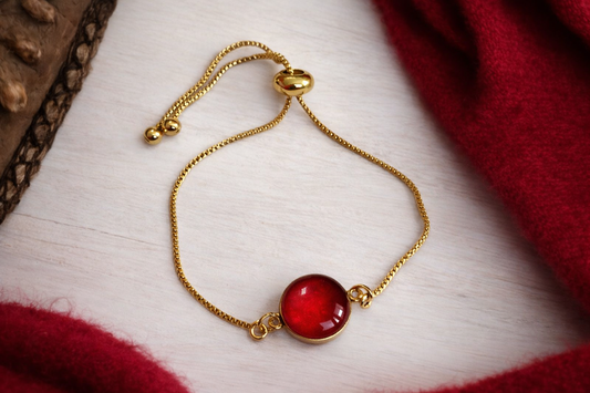 BRANSOLETKA REGULOWANA CANDY W KOLORZE ZŁOTYM - CZERWONE OCZKO
